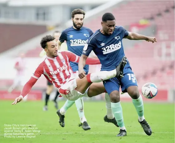  ??  ?? Stoke City’s matchwinne­r Jacob Brown gets stuck in against Derby’s Teden Mengi during Saturday’s game. Photo by Leanne Bagnall