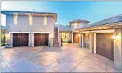  ?? Interior Pixels ?? JASON KUBEL’S Tuscan-inspired Calabasas home includes a large motor court and a four-car garage.