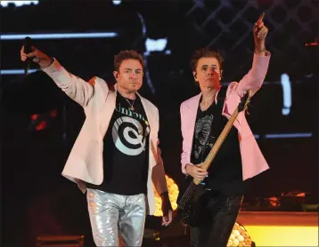  ?? PHOTO BY KELLY A. SWIFT ?? Simon Le Bon and John Taylor of Duran Duran perform at the Hollywood Bowl on Friday.