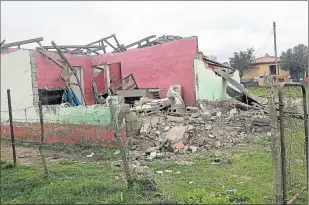  ?? Pictures: NONSINDISO QWABE ?? FLATTENED: Homes in Kayamnandi Village were destroyed by a violent tornado three weeks ago