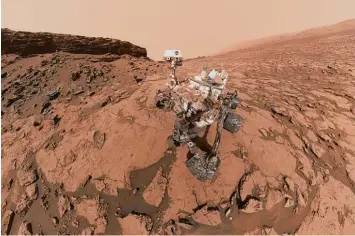  ?? Foto: Nasa, dpa ?? Dieses Foto der Nasa zeigt den Weltraum Roboter Curiosity bei der Arbeit auf dem Planeten Mars. Die Aufnahme entstand am so genannten Mount Sharp, einem Berg, den der Roboter untersucht.