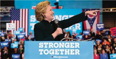  ?? —AP ?? CLEVELAND: Democratic presidenti­al candidate Hillary Clinton points to the crowd while speaking at a rally at Cuyahoga Community College.