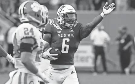  ?? ROB KINNAN/USA TODAY SPORTS ?? North Carolina State running back Trent Pennix signals a first down after a catch against Clemson on Sept. 25 in Raleigh, N.C.