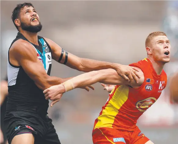  ??  ?? Paddy Ryder, of the Power, and Suns tall Peter Wright compete in a ruck contest yesterday at Jiangwan Sports Stadium in Shanghai. Picture: GETTY IMAGES