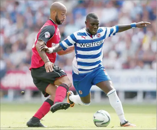  ??  ?? OUT OF MY WAY: Reading's Royston Drenthe brushes aside David McGoldrick