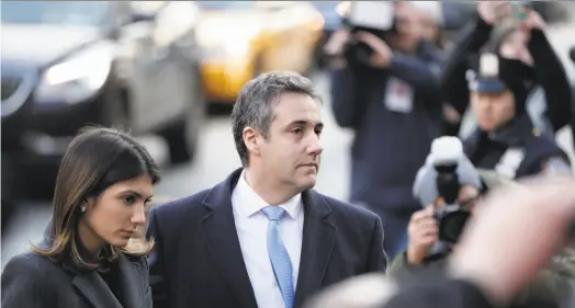  ?? Julio Cortez / Associated Press ?? Michael Cohen, President Trump’s former lawyer, arrives at federal court in New York with his daughter, Samantha.