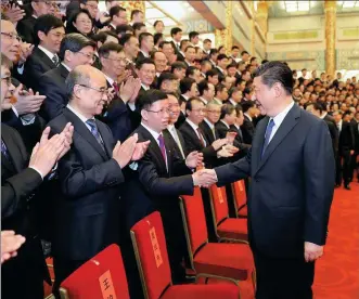  ?? JU PENG / XINHUA ?? President Xi Jinping meets space scientists and engineers involved in the research and developmen­t of the Chang’e 4 lunar mission in the Great Hall of the People in Beijing on Wednesday.