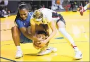  ?? Tony Avelar Associated Press ?? UCLA’S Charisma Osborne, left, battles Stanford’s Lexie Hull for a loose ball during the first half.