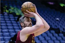  ?? MATTHEW HINTON — THE ASSOCIATED PRESS FILE ?? Cleveland Cavaliers forward Kevin Love warms up before a game against the New Orleans Pelicans in New Orleans on Friday, Feb. 10.