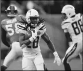 ?? Associated Press ?? HE’S BACK In this Dec. 30, 2018, file photo, Chargers running back Melvin Gordon rushes against the Denver Broncos in Denver. Gordon ended his holdout on Thursday.