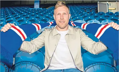  ?? Picture: SNS Group, ?? Scott Arfield sports Rangers colours after putting pen to paper on a four-year deal.