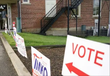  ?? Keith Srakocic/Associated Press ?? A voter enters the polling location to cast a ballot in the Pennsylvan­ia primary election on May 17 in Harmony.