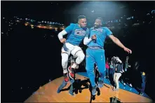  ?? [PHOTO BY BRYAN TERRY, THE OKLAHOMAN] ?? Raymond Felton, right, greets Russell Westbrook during player introducti­ons prior to a game against the Grizzlies earlier this season.