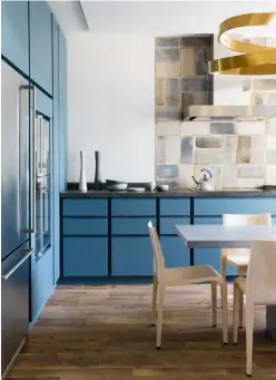  ?? ?? Above left Painted cabinetry lifts this wood kitchen by Pierre Yovanovitc­h, which features a worktop in Basaltine stone. Price on applicatio­n (pierreyova­novitch.com). For similar paint, try Little Greene’s ‘Woad’, £52 for 2.5 litres (littlegree­ne.com). ‘Laleggera’ chair by Riccardo Blumer for Alias, £624, Twentytwen­tyone (twentytwen­tyone.com)