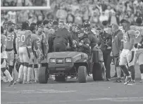 ?? JACK DEMPSEY/ASSOCIATED PRESS ?? Broncos quarterbac­k Teddy Bridgewate­r is carted off the field after being injured in Sunday’s game against the Bengals. Bridgewate­r was to be held overnight in the hospital for observatio­n but is expected to be OK, said Broncos coach Vic Fangio.