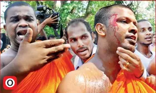  ??  ?? A monk suffered slight injuries at the protest in front of the Prime Minister’s office yesterday.
(Pic by Samantha Perera)