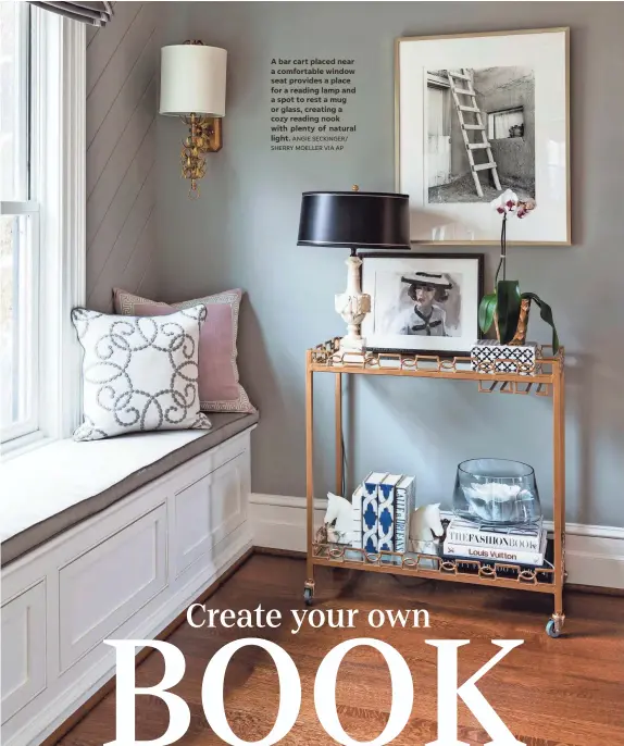  ?? SHERRY MOELLER VIA AP ?? A bar cart placed near a comfortabl­e window seat provides a place for a reading lamp and a spot to rest a mug or glass, creating a cozy reading nook with plenty of natural light. ANGIE SECKINGER/