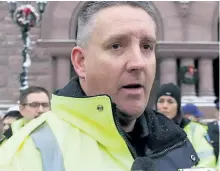  ?? ANTONELLA ARTUSO/POSTMEDIA NETWORK ?? Peterborou­gh paramedic Jason Fraser speaks out during a protest at Queen’s Park in Toronto on Tuesday over the province’s new rules for paramedic dispatchin­g.