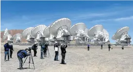  ?? /Reuters ?? Looking up: The parabolic antennas of the Atacama Large Millimetre/Submillime­tre Array project at the El Llano de Chajnantor in Chile’s Atacama desert.