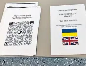  ?? ?? QR codes to apply to the family visa scheme were handed out. But people must travel to either Paris or Brussels to finish the process