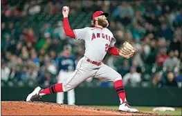  ?? TED S. WARREN / AP ?? Los Angeles Angels closing pitcher Archie Bradley throws against the Seattle Mariners during the ninth inning of the second baseball game of a doublehead­er on June 18.
