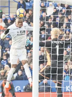  ??  ?? Crystal Palace’s Zaire-born Belgian striker Christian Benteke (centre) has an unsuccessf­ul attempt on goal during the English Premier League football match between Leicester City and Crystal Palace at King Power Stadium in Leicester, central England. —...