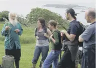  ??  ?? Tom Forsyth talking to visitors to Eigg in 2005