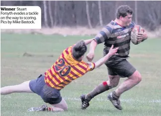  ??  ?? Winner Stuart Forsyth evades a tackle on the way to scoring. Pics by Mike Bastock.