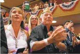  ?? MANDEL NGAN/AGENCE FRANCE-PRESSE VIA GETTY IMAGES ?? People cheer as President Donald Trump speaks Friday in Miami, Florida.