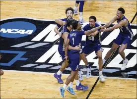  ?? AJ MAST/ASSOCIATED PRESS ?? Oral Roberts players celebrate at the end of a college basketball game against Florida in the second round of the NCAA tournament at Indiana Farmers Coliseum, Sundayin Indianapol­is. Oral Roberts won 81-78.