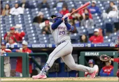  ?? LAURENCE KESTERSON THE ASSOCIATED PRESS ?? New York Mets designated hitter Pete Alonso (20) follows through on a three-run home run during the fifth inning of the second game of a baseball doublehead­er against the Philadelph­ia Phillies, Sunday, May 8, 2022, in Philadelph­ia.