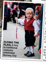  ??  ?? FLYING THE FLAG: A boy in traditiona­l costume celebrates Norway Day