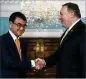  ?? CAROLYN KASTER / ASSOCIATED PRESS ?? Secretary of State Mike Pompeo greets Japanese Foreign Minister Taro Kono at the State Department on Wednesday.