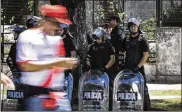  ?? MARCELO ENDELLI / GETTY IMAGES ?? Riot police stand guard outside of Monumental Stadium in Buenos Aires, Argentina.