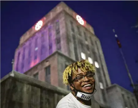  ?? Jon Shapley / Staff photograph­er ?? Quintarius Oliver smiles during a celebrator­y rally at City Hall hours after several news organizati­ons called Pennsylvan­ia for Democrat Joe Biden, which gave him the 270 Electoral College votes needed to become the next president.