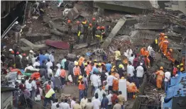  ?? — PTI ?? Rescue operations underway after a building collapsed in Bhiwandi city near Thane on Saturday. At least two persons were killed and five others injured in the collapse. The tragedy could have been much worse had the families residing in the residentia­l complex not been moved out in time after cracks were spotted in it late Friday night, officials said.