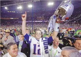  ?? DAVID J. PHILLIP/ASSOCIATED PRESS ?? Tom Brady celebrates after New England defeated Seattle in the Super Bowl six years ago. He led the Patriots to two fourth-quarter touchdowns in a comeback victory.