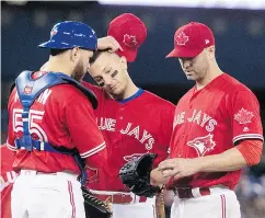  ?? FRED THORNHILL / THE CANADIAN PRESS FILES ?? From left, Russell Martin, Troy Tulowitzki and J.A. Happ are all part of the US$90 million on the Jays’ disabled list.
