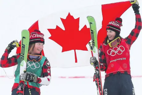  ?? JEAN LEVAC ?? Kelsey Serwa, right, of Kelowna, B.C., and Brittany Phelan of Mont-Tremblant, Que., celebrate after finishing first and second in the women’s ski cross final at the Pyeongchan­g Winter Games on Friday, securing Canada’s 25th and 26th medals of the...