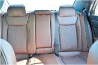  ??  ?? The sedan can easily accomodate four adults and the seats are broad and flat, with a dark brown Nappa leather that feels good.