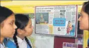  ?? MUJEEB FARUQUI/HT ?? Students read a poster about Nobel laureate Malala Yousafzai in Bhopal on Saturday.