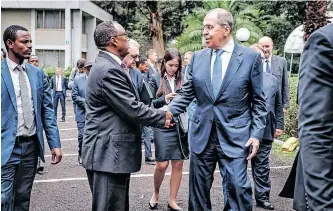  ?? AFP ?? RUSSIAN Foreign Affairs Minister Sergey Lavrov, centre, greets Demeke Mekonnen, the Ethiopian deputy prime minister and minister of foreign affairs, at the Russian embassy, in Addis Ababa, last week. |