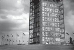  ?? Mcclatchy Tribune/brian CASSELLA ?? “If you didn’t know, you would think it was part of the monument,” a visitor said of the Washington Monument’s protective — and some say decorative — scaffoldin­g.