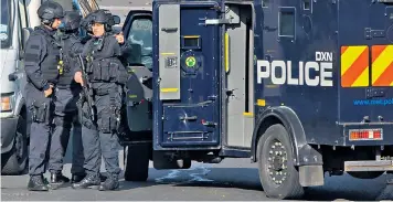  ??  ?? Armed police outside the council house in Northolt, north-west London. The house’s resident has been named as Jason Matthews, 46