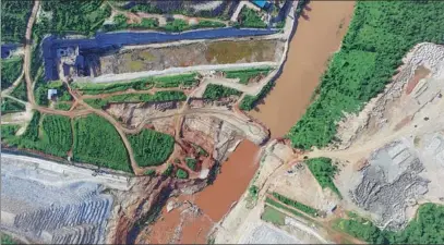  ?? TANG YAZHOU / XINHUA ?? Constructi­on of the Thwake Dam, as seen on Dec 30, is proceeding at a site south of Nairobi. Upon completion, the dam will provide Kenyans with power and water.