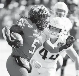  ?? JUSTIN CASTERLINE/GETTY ?? Purdue’s defense held Maryland’s Anthony McFarland Jr. to just 4 rushing yards on Saturday, his worst performanc­e since the 2018 season opener.