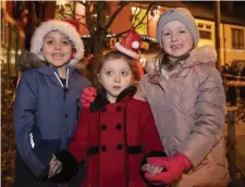  ??  ?? Eoin Lane with his sister Caoimhe and their friend Lauren O’Sullivan in Abbeyfeale last Friday night for the switching on of the Christmas lights.