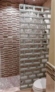  ?? Photo courtesy of Masonry & Glass Systems Inc. ?? This glass block shower wall is beautiful and functional.