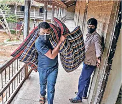  ??  ?? A PUNE MUNICIPAL CORPORATIO­N worker at Fergusson College’s boys hostel, which is being converted into an isolation ward for COVID-19 patients, on July 17.