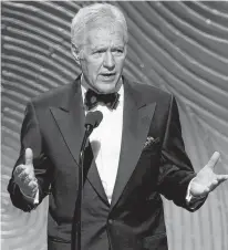  ?? DANNY MOLOSHOK/ REUTERS FILE PHOTO ?? ‘Jeopardy’ television game show host Alex Trebek speaks on stage during the 40th annual Daytime Emmy Awards in Beverly Hills, Calif. in this June 16, 2013 file photo.